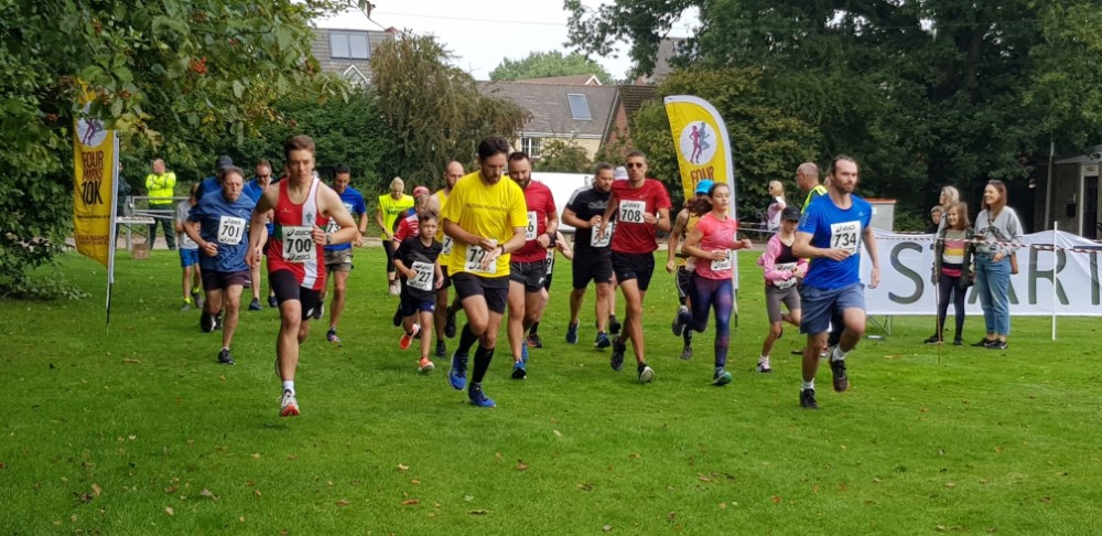 5k runners cross the starting line at the Four Marks 10k