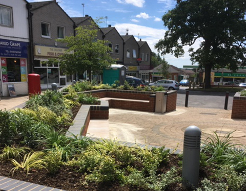 Seating area across from shops